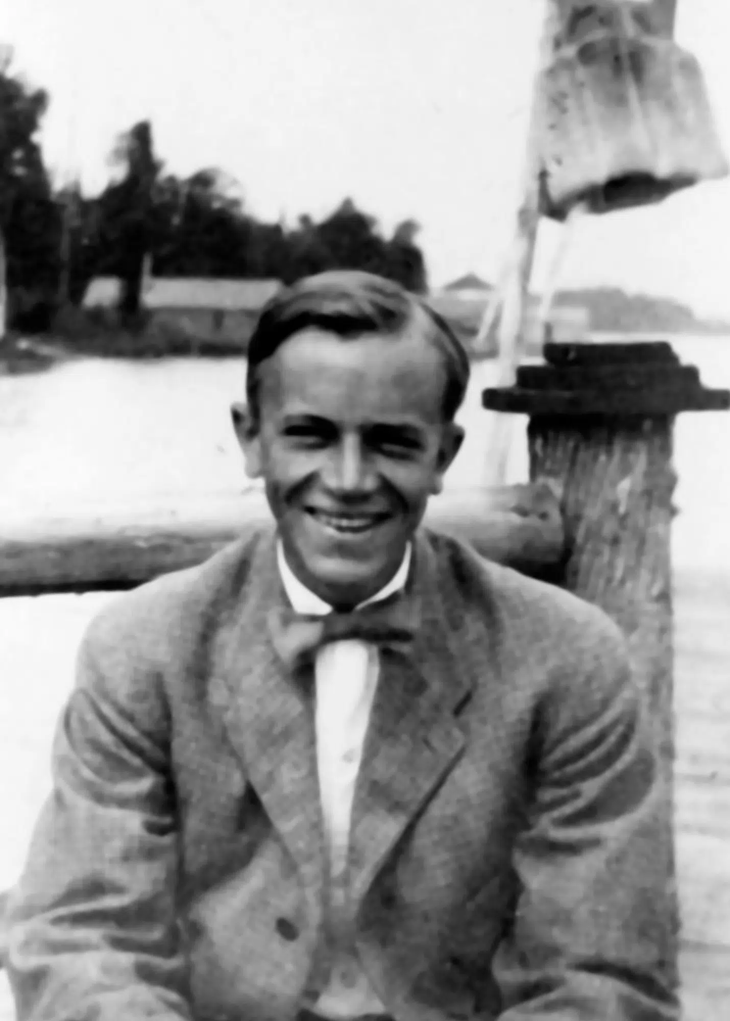 Aldo Leopold sitting on the dock at Les Cheneaux, ca. 1908.